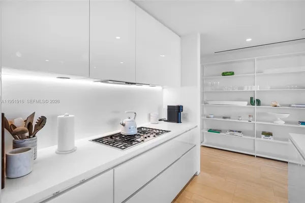 a kitchen with a stove and cabinets