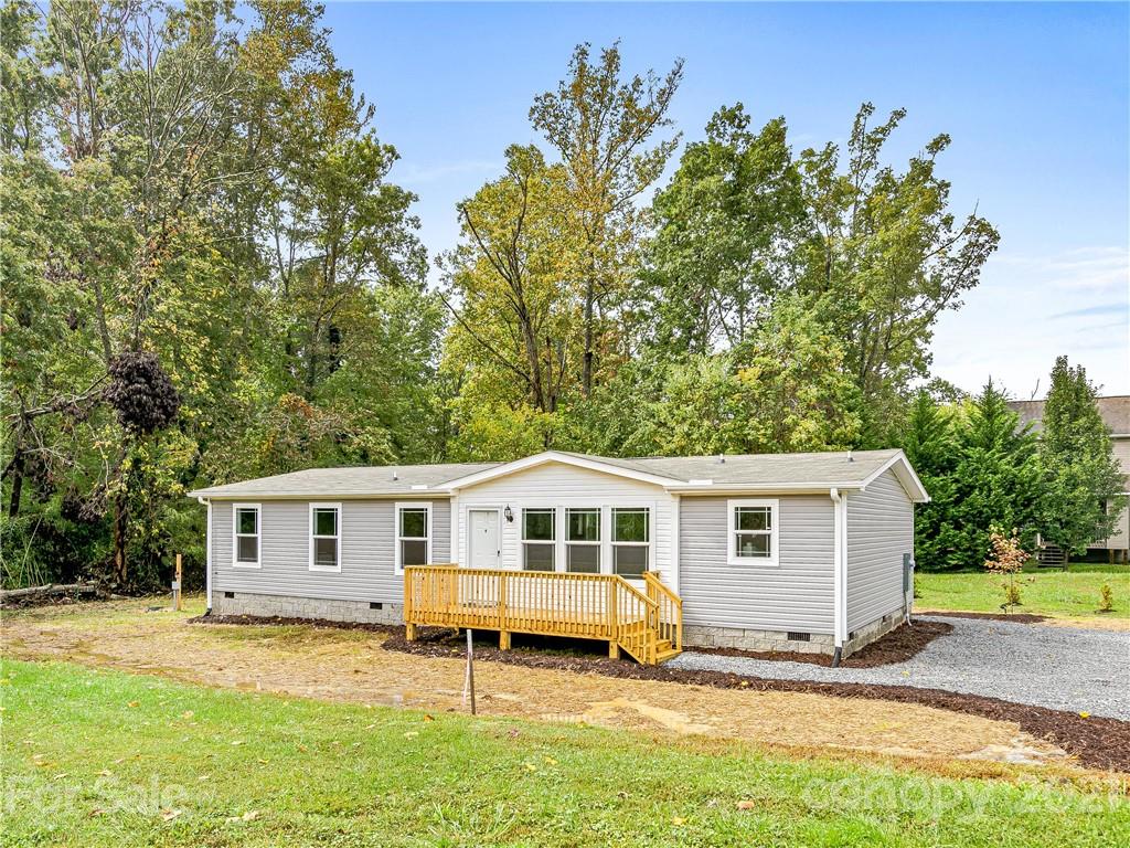 14 Souther Road Fletcher, NC 28732 - Photo 1 of 25 a view of a house with a backyard and a tree
