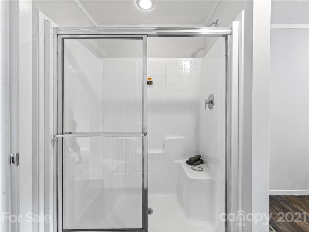 14 Souther Road Fletcher, NC 28732 - Photo 18 of 25 a bathroom with a glass shower door
