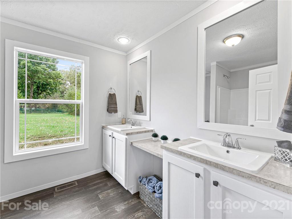 14 Souther Road Fletcher, NC 28732 - Photo 22 of 25 a bathroom with a sink double vanity and a mirror