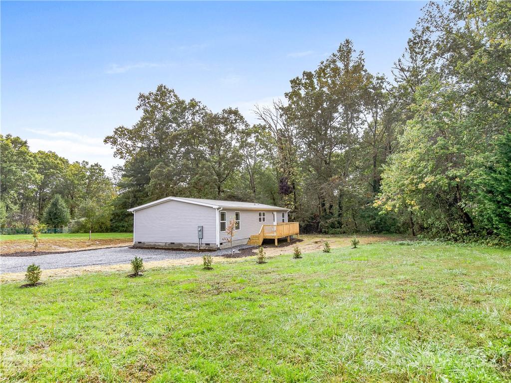 14 Souther Road Fletcher, NC 28732 - Photo 24 of 25 a view of a house with backyard and sitting area