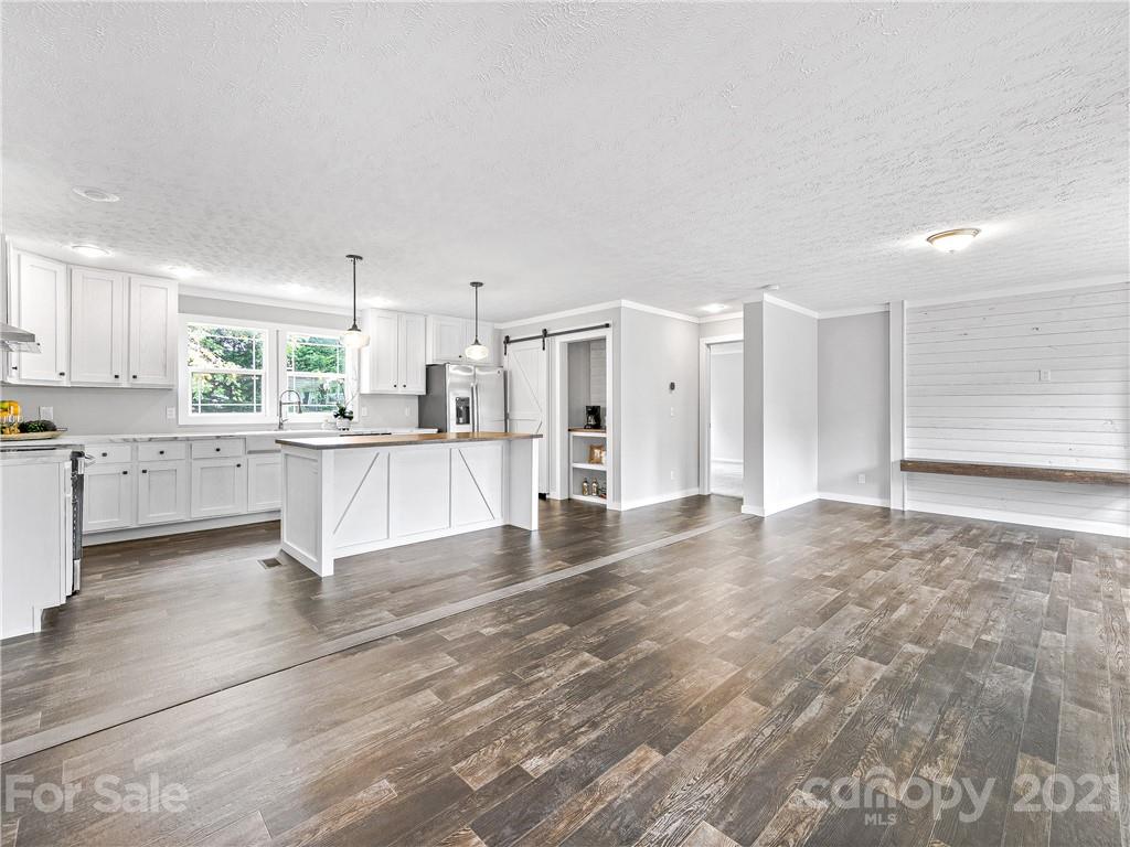 14 Souther Road Fletcher, NC 28732 - Photo 7 of 25 a view of a kitchen with wooden floor and electronic appliances