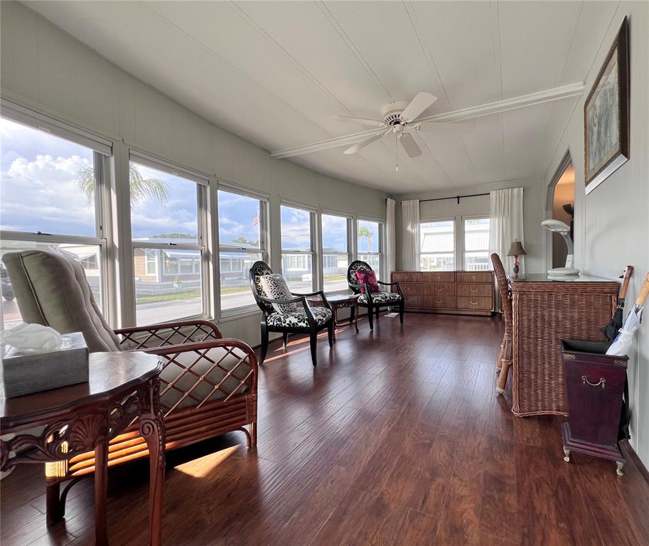 1100 South Belcher Road, Unit 772 Largo, FL 33771 - Photo 7 of 84 a living room with furniture and wooden floor