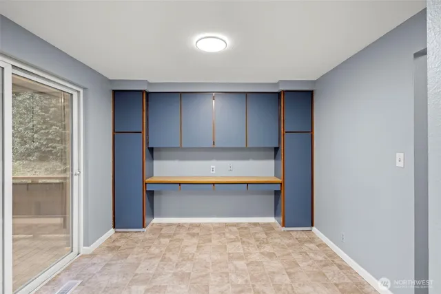 a bathroom with a tub and shower