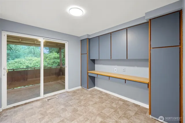 a view of a balcony with wooden floor