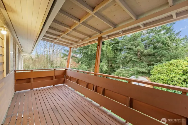 a view of balcony with wooden floor