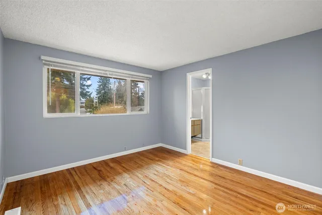 a bathroom with a sink toilet a mirror and shower