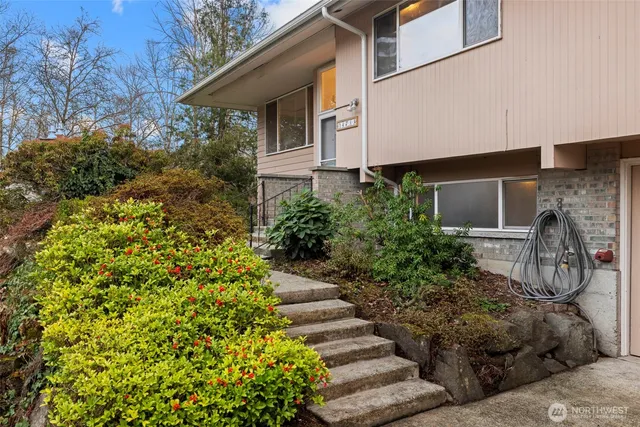 a front view of a house with garden
