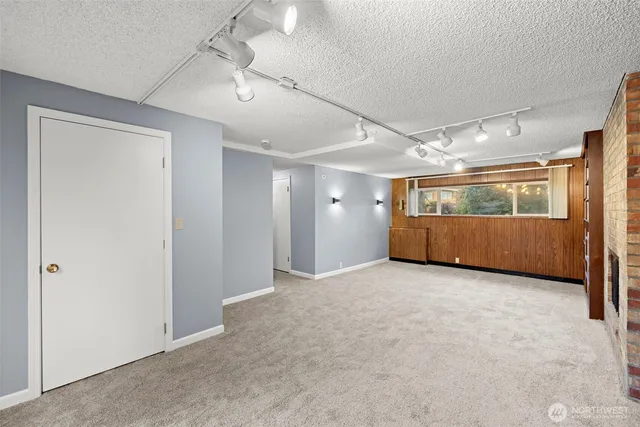 a bathroom with a sink mirror and window