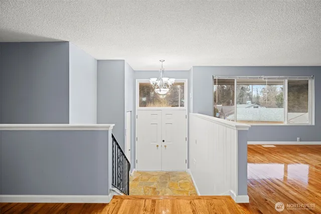 a view of a room with window and wooden floor