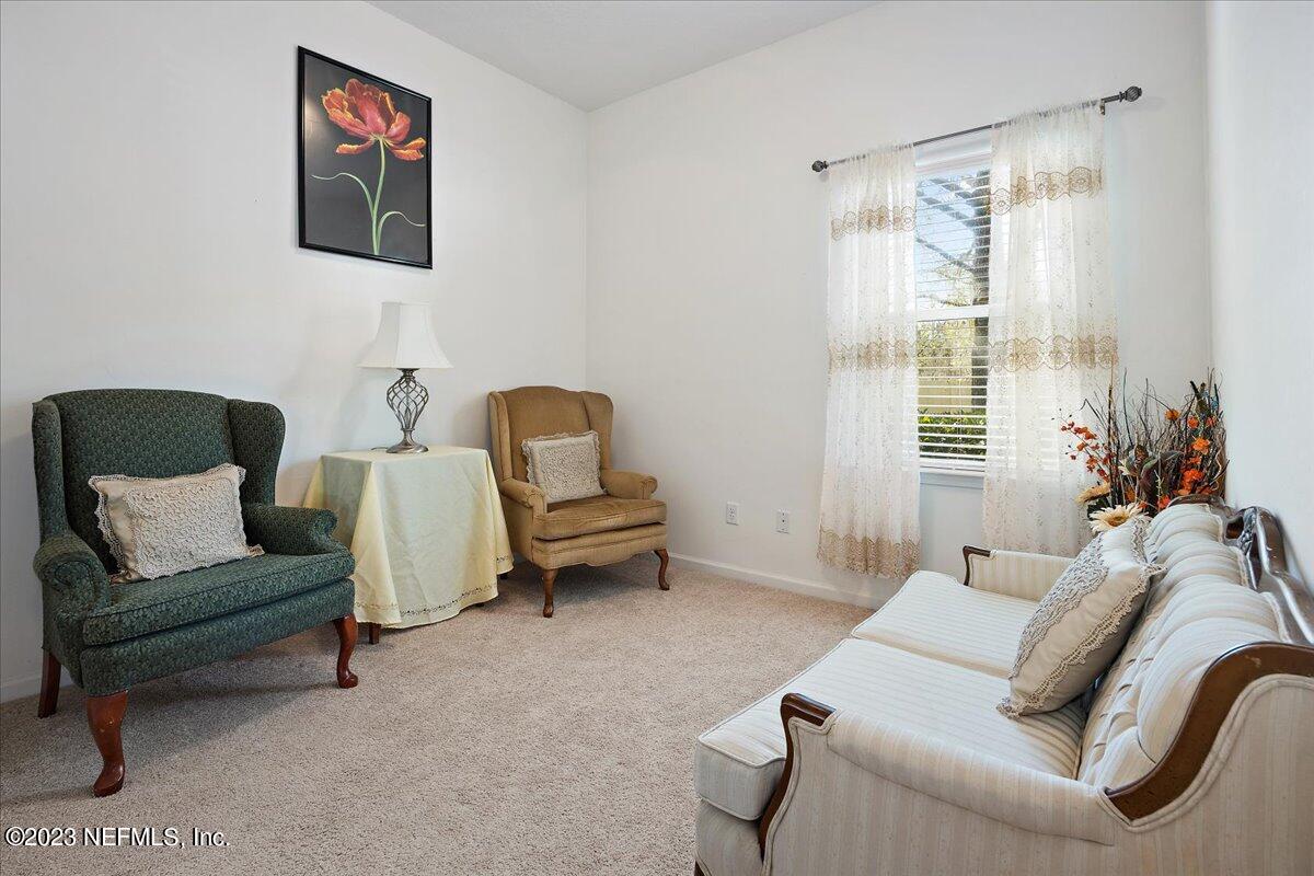 605 Golden Lake Loop St. Augustine, FL 32084 - Photo 14 of 20 a living room with furniture and a large window