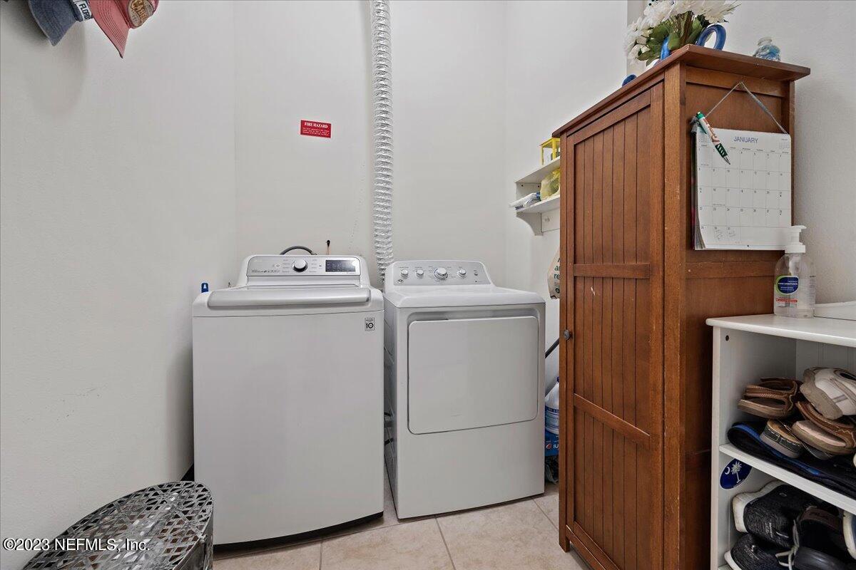 605 Golden Lake Loop St. Augustine, FL 32084 - Photo 17 of 20 a utility room with dryer and washer