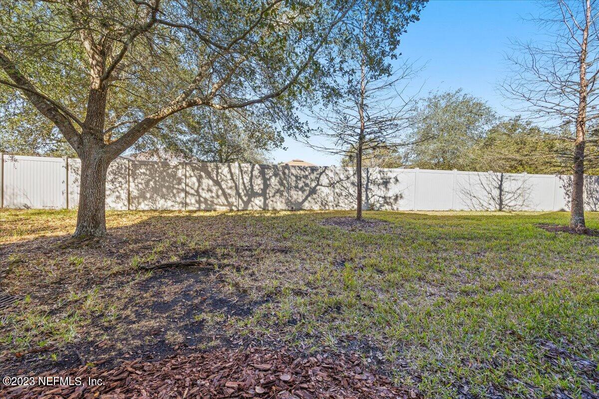 605 Golden Lake Loop St. Augustine, FL 32084 - Photo 18 of 20 a view of swimming pool with a yard