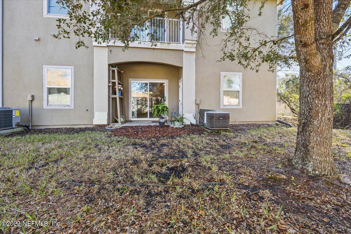 605 Golden Lake Loop St. Augustine, FL 32084 - Photo 19 of 20 a front view of a house with garden