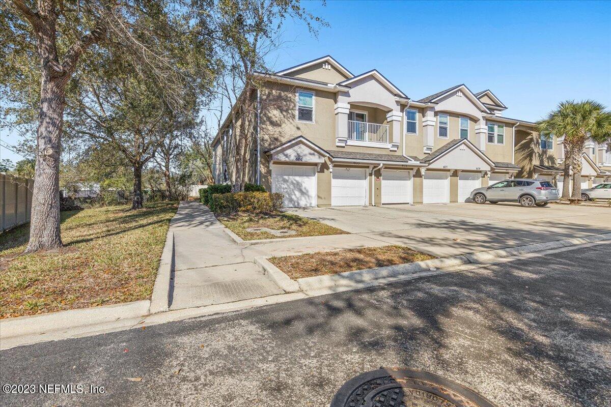 605 Golden Lake Loop St. Augustine, FL 32084 - Photo 2 of 20 a front view of a house with a yard