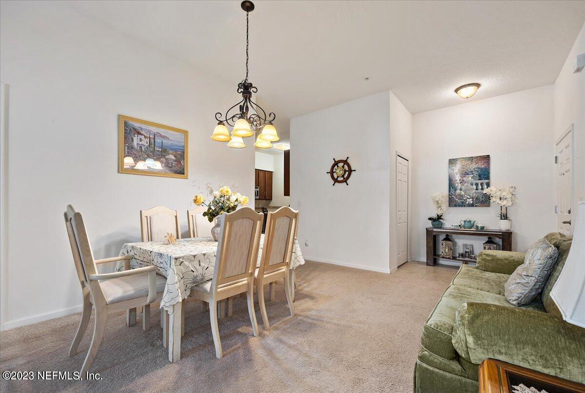 605 Golden Lake Loop St. Augustine, FL 32084 - Photo 7 of 20 a view of a dining room with furniture