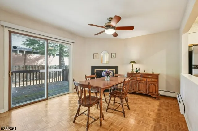 a view of a dining room with furniture window and outside view