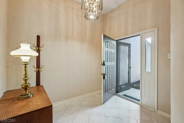 a view of a hallway with a chandelier