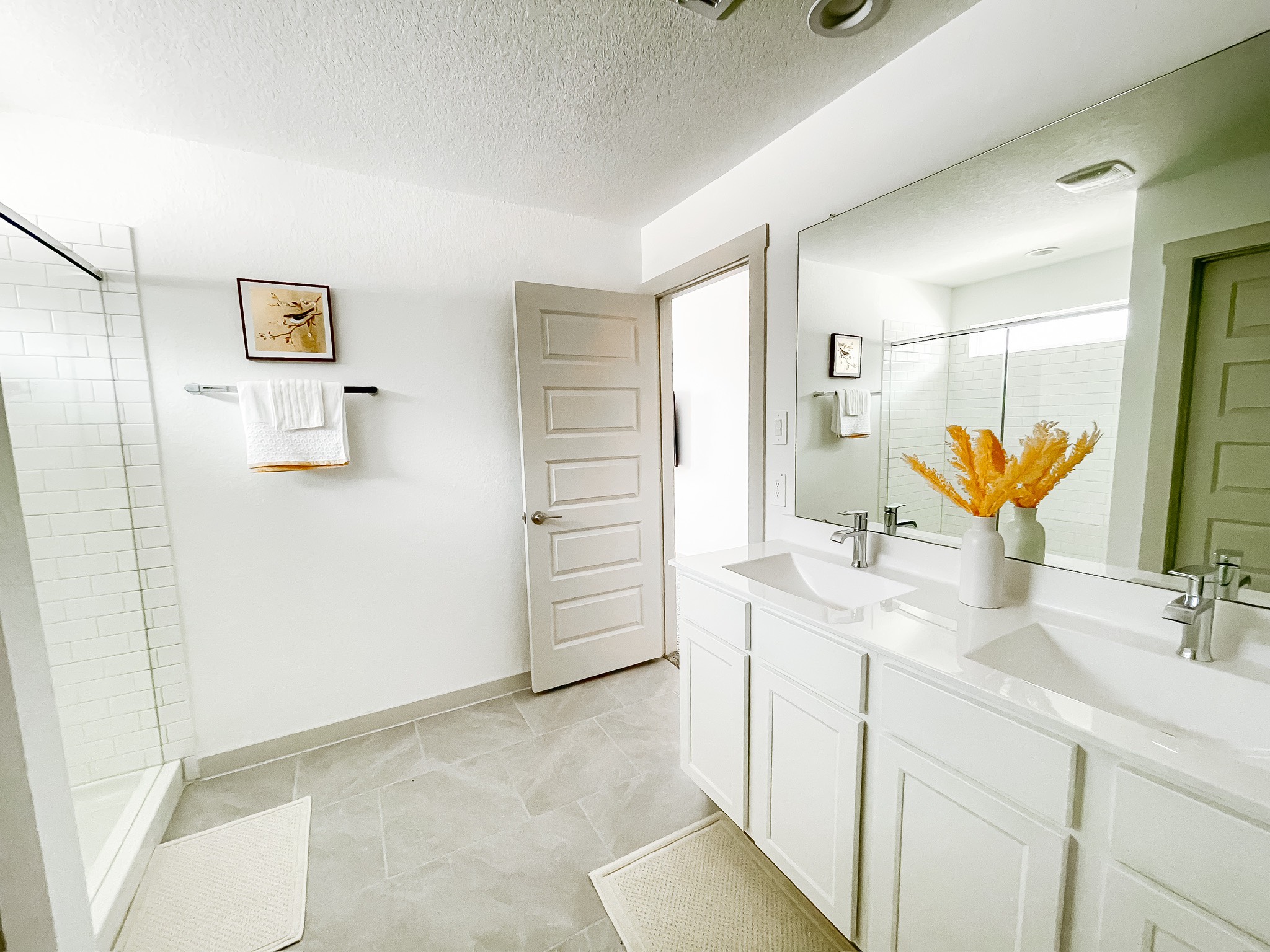 29830 Wildcat Way Katy, TX 77494 - Photo 11 of 17 a bathroom with a double vanity sink mirror and shower
