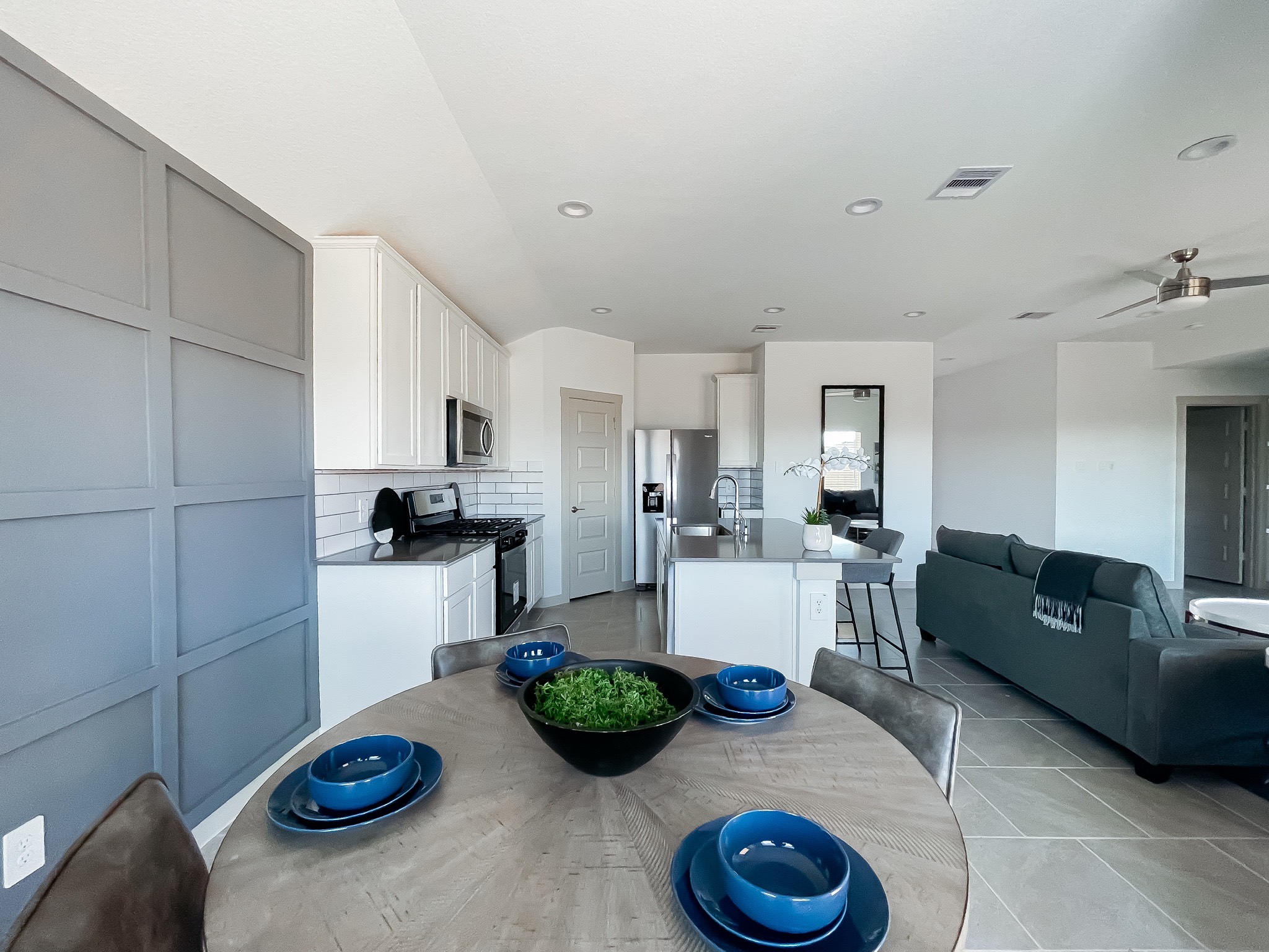 29830 Wildcat Way Katy, TX 77494 - Photo 8 of 17 a kitchen with a refrigerator a stove and white cabinets