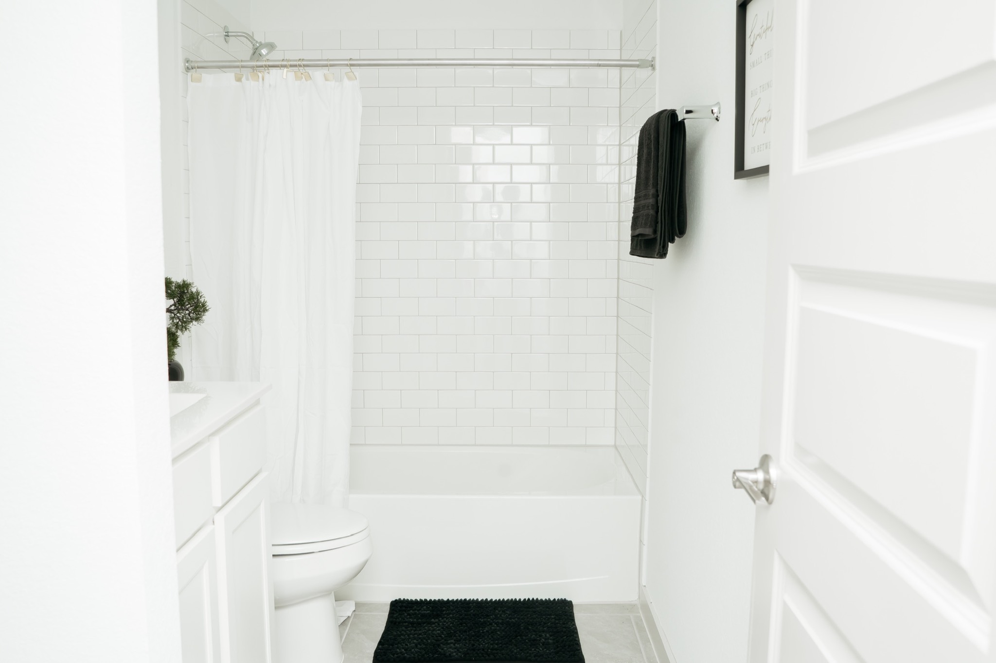 29830 Wildcat Way Katy, TX 77494 - Photo 9 of 17 a bathroom with a shower curtain a sink and a toilet