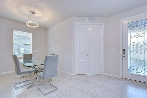 a view of a room with furniture and wooden floor