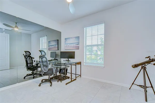 a dining room with furniture and window