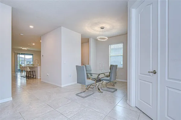 a kitchen with stainless steel appliances granite countertop a sink refrigerator and cabinets