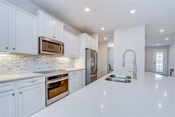 a view of kitchen with dining table and chairs