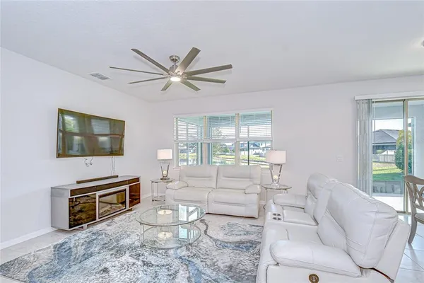 a bedroom with a bed lamp and window