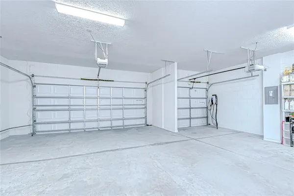 a living room with furniture and a ceiling fan