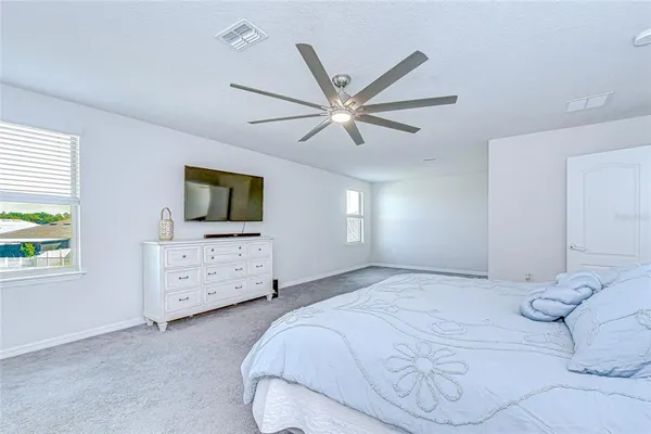 a view of a lake with outdoor seating