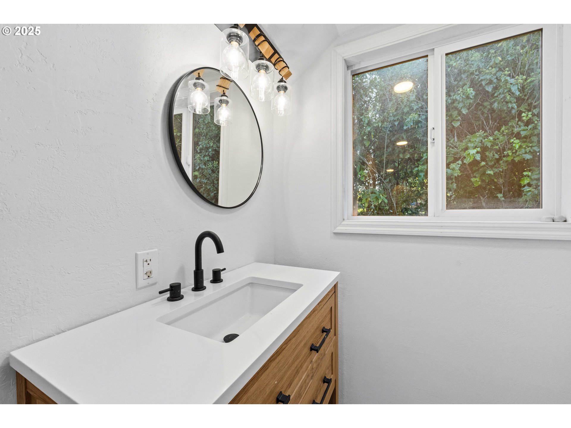 62356 Olive Barber Road Coos Bay, OR 97420 - Photo 32 of 34 a bathroom with a sink and a mirror