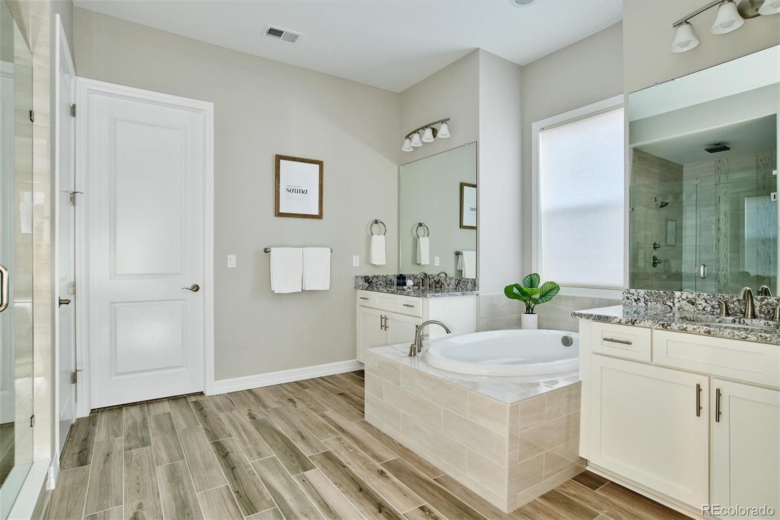 4907 Hogback Ridge Road Morrison, CO 80465 - Photo 19 of 40 a bathroom with a sink and a mirror
