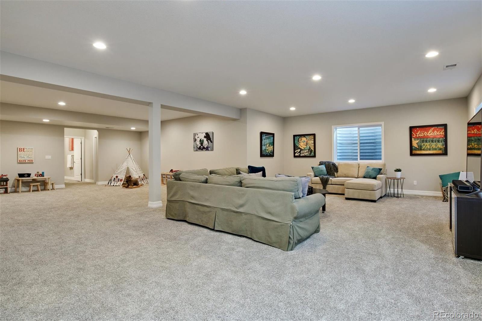 4907 Hogback Ridge Road Morrison, CO 80465 - Photo 25 of 40 a living room with furniture and a window