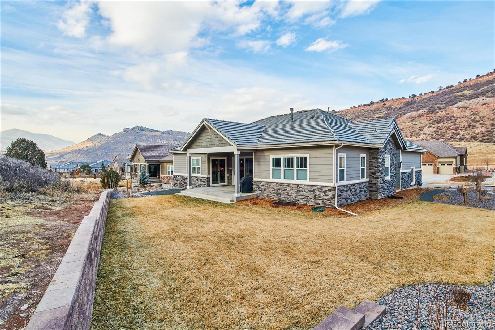 4907 Hogback Ridge Road Morrison, CO 80465 - Photo 37 of 40 a view of a house with swimming pool and sitting area
