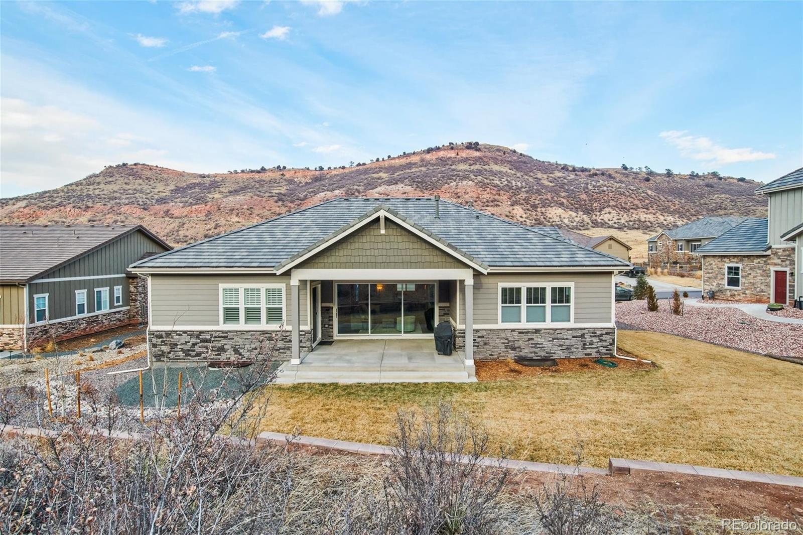 4907 Hogback Ridge Road Morrison, CO 80465 - Photo 40 of 40 front view of a house with a yard