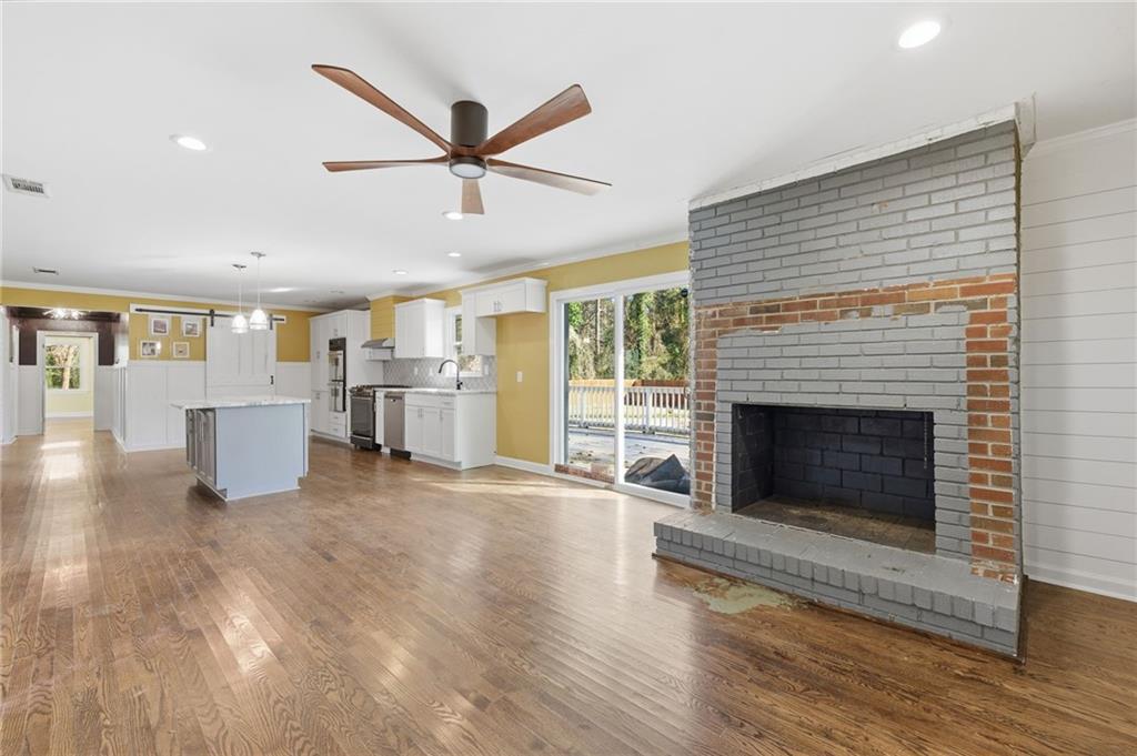 1532 Alverado Way Decatur, GA 30032 - Photo 14 of 41 a living room with furniture and a fireplace