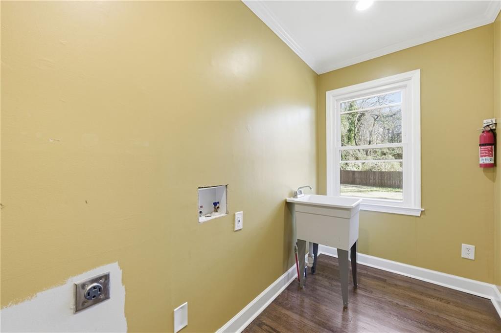 1532 Alverado Way Decatur, GA 30032 - Photo 18 of 41 a view of a workspace with wooden floor and a window
