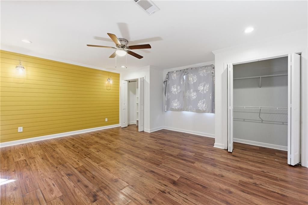 1532 Alverado Way Decatur, GA 30032 - Photo 19 of 41 a view of an empty room with wooden floor and a window