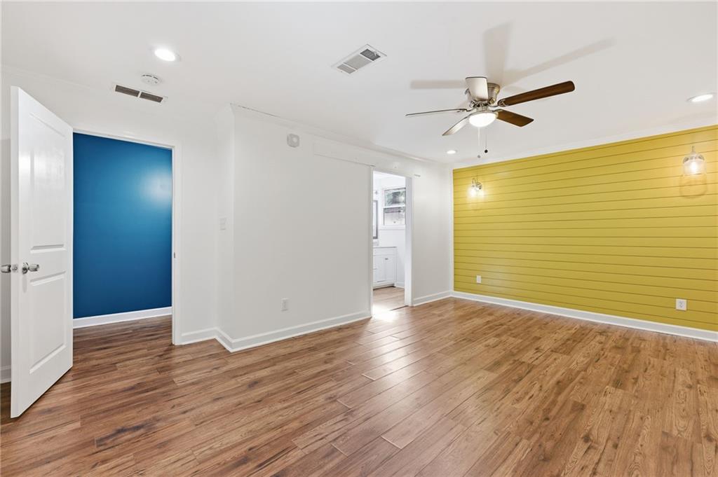 1532 Alverado Way Decatur, GA 30032 - Photo 20 of 41 a view of a big room with wooden floor and windows