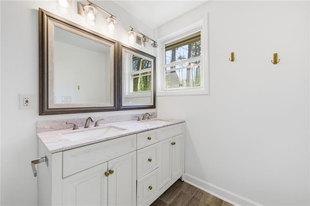 1532 Alverado Way Decatur, GA 30032 - Photo 23 of 41 a bathroom with a toilet sink and mirror
