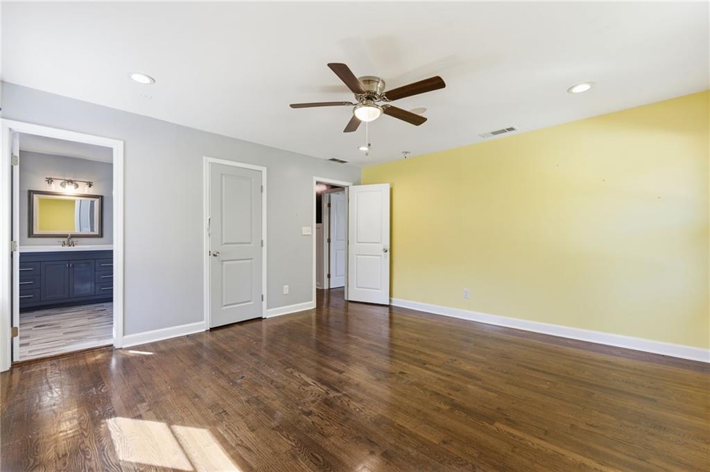 1532 Alverado Way Decatur, GA 30032 - Photo 28 of 41 an empty room with wooden floor and windows