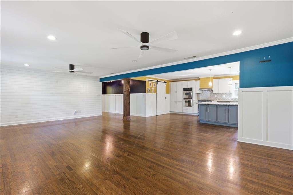 1532 Alverado Way Decatur, GA 30032 - Photo 4 of 41 a view of an empty room with wooden floor and a window