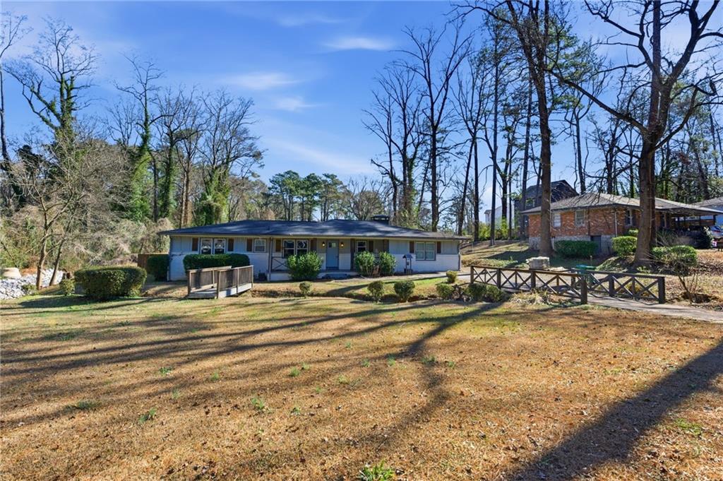 1532 Alverado Way Decatur, GA 30032 - Photo 41 of 41 a view of a swimming pool with sitting area and garden