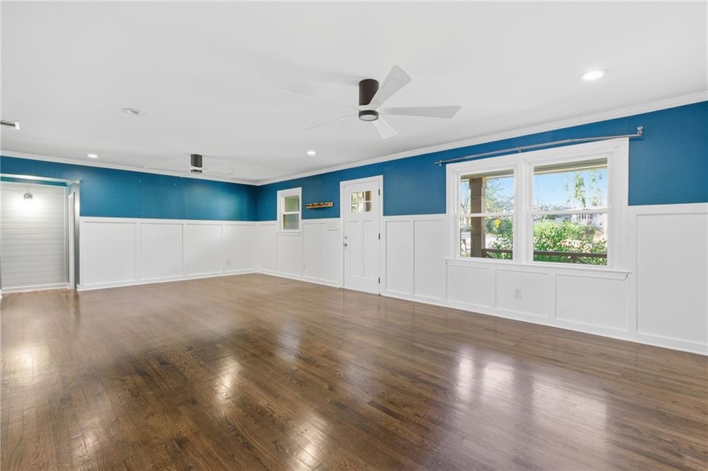 1532 Alverado Way Decatur, GA 30032 - Photo 6 of 41 a view of an empty room with wooden floor and a window