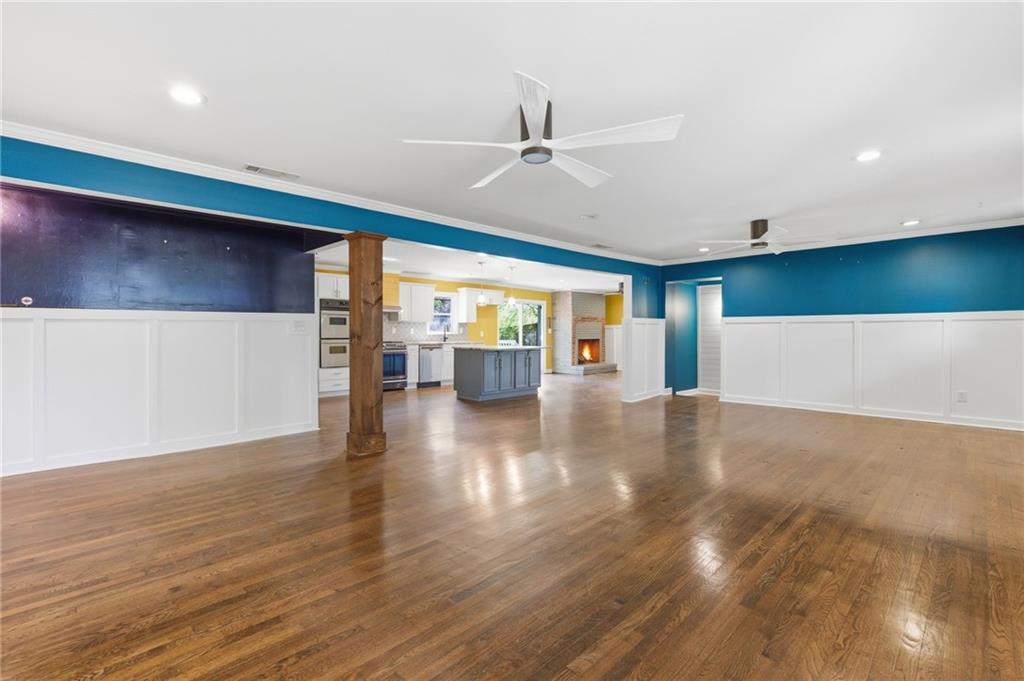 1532 Alverado Way Decatur, GA 30032 - Photo 7 of 41 a view of an empty room with wooden floor and a window