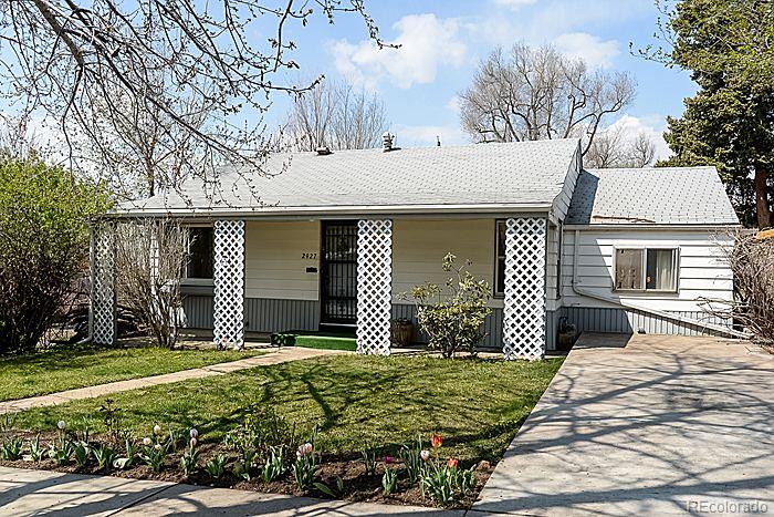 2927 Chase Street Wheat Ridge, CO 80214 - Photo 1 of 1 a front view of a house with a garden