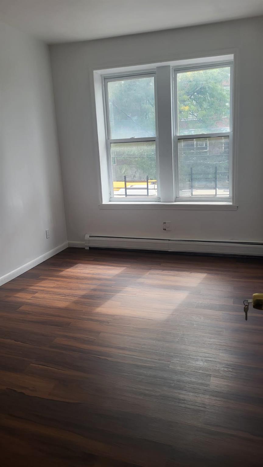 a view of an empty room with a window