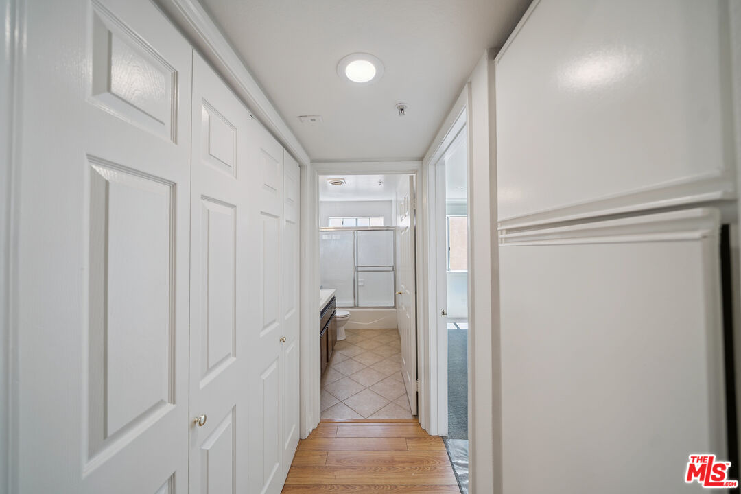 1508 Greenfield Avenue, Unit 206 Los Angeles, CA 90025 - Photo 14 of 31 a view of a hallway with wooden shelves